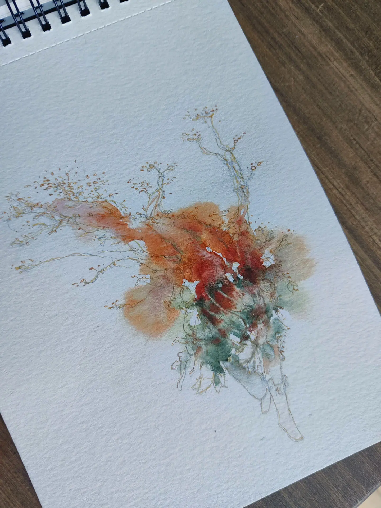 Red and green watercolour creature study in a sketchbook by Nicolas Crombez