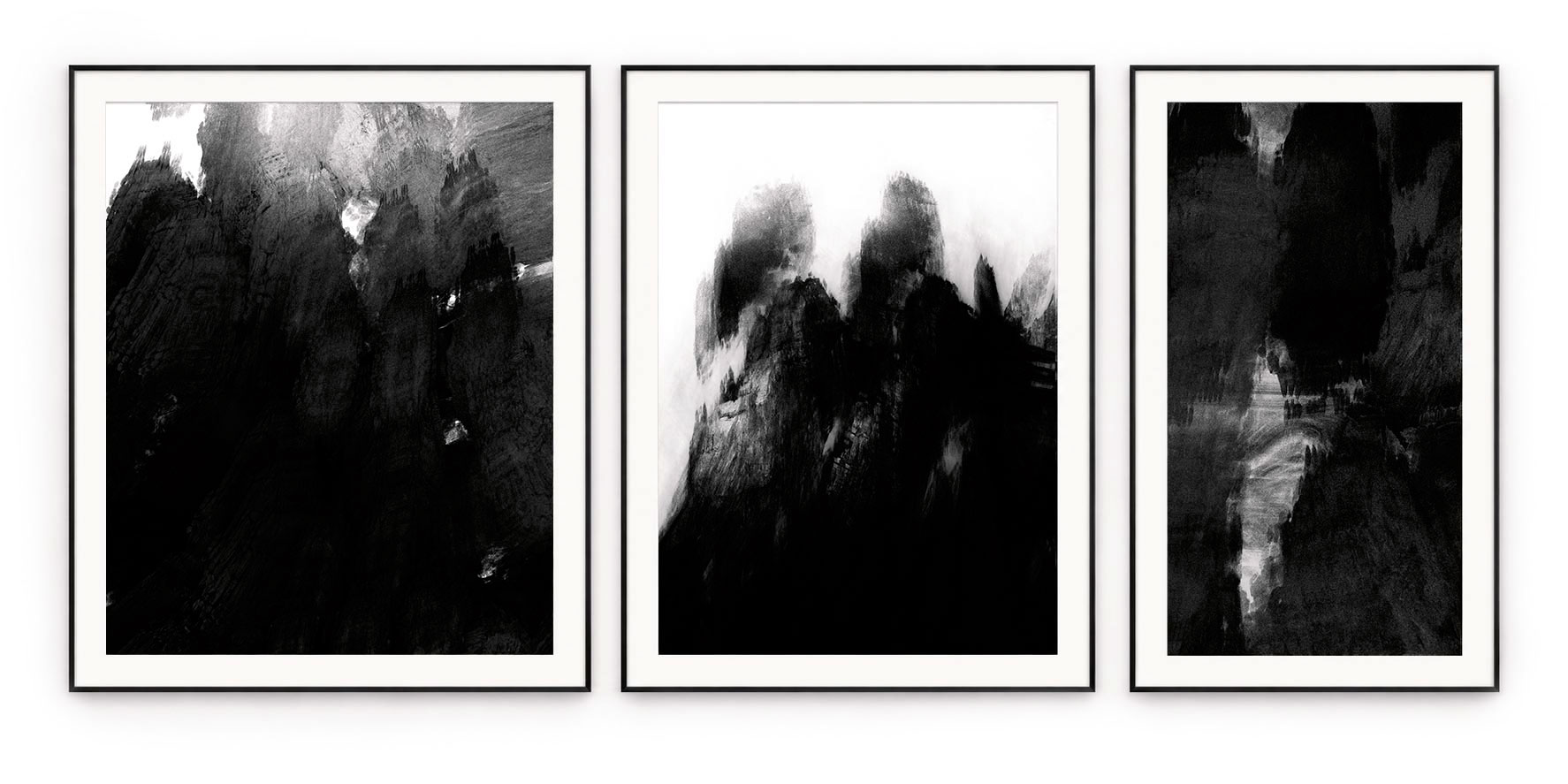 Three monochrome abstract paintings with black, grey and white textures, in black frames with white mounts