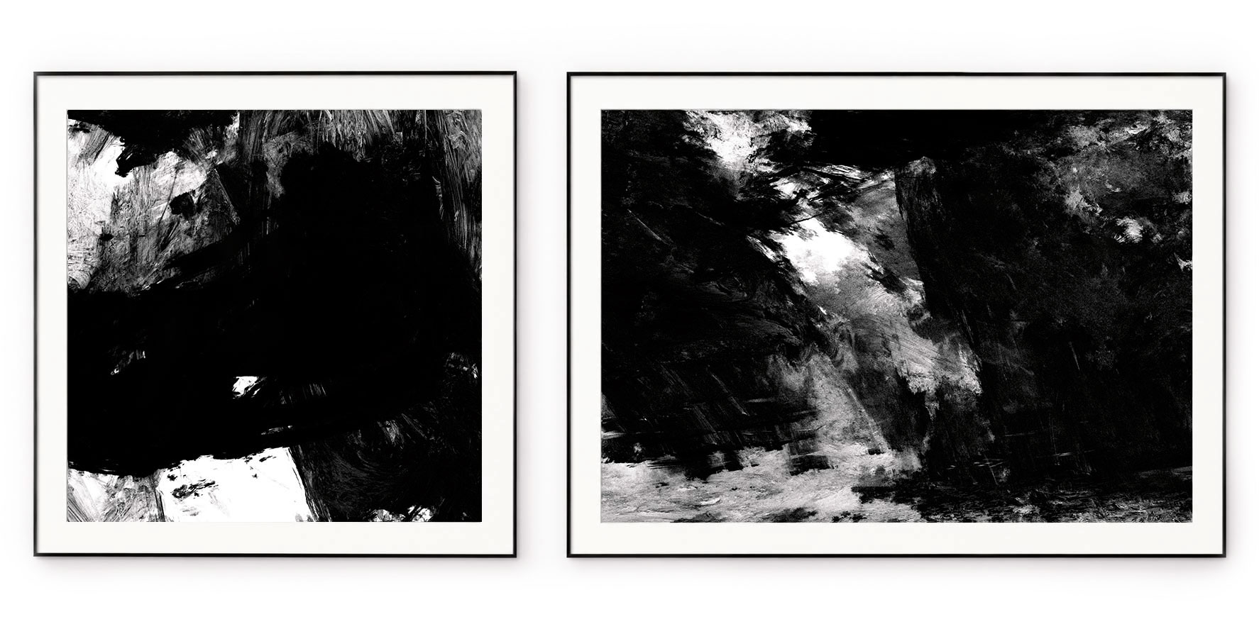 A monochrome abstract diptych with black, white and silver textures, in thin black frames with white mounts
